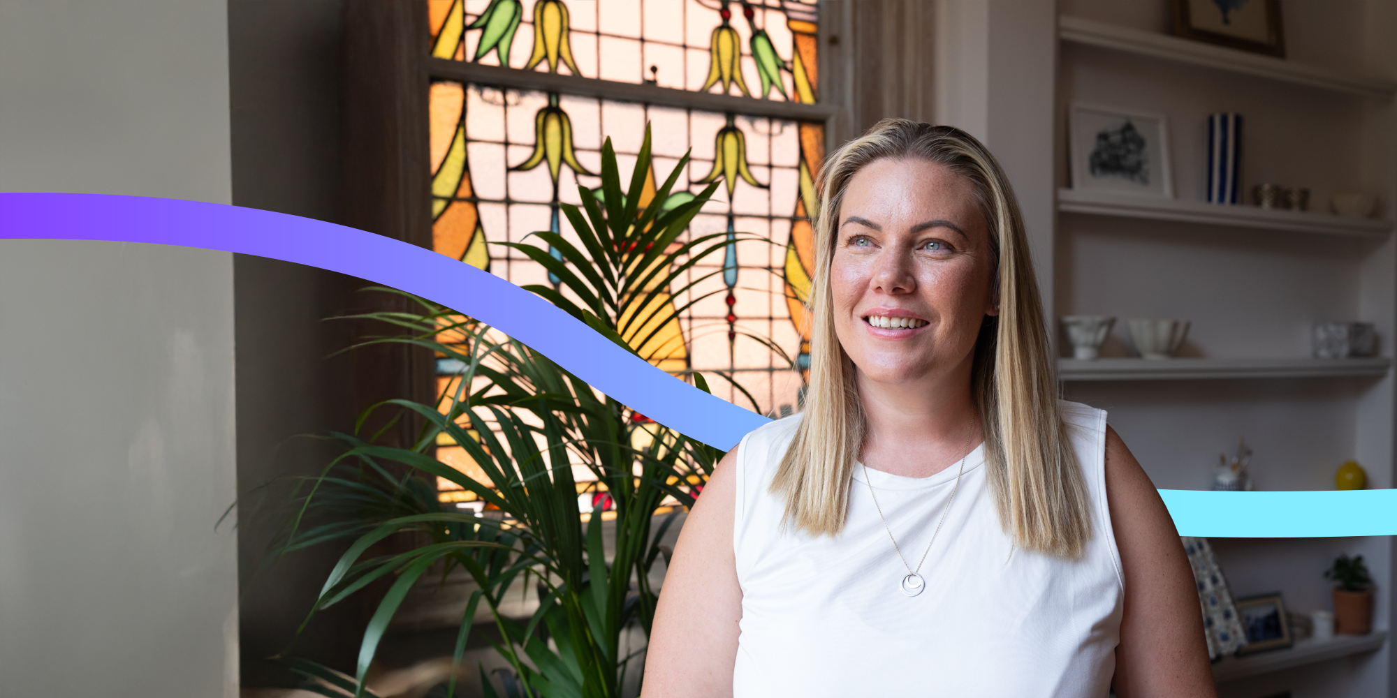Smiling women in her house.